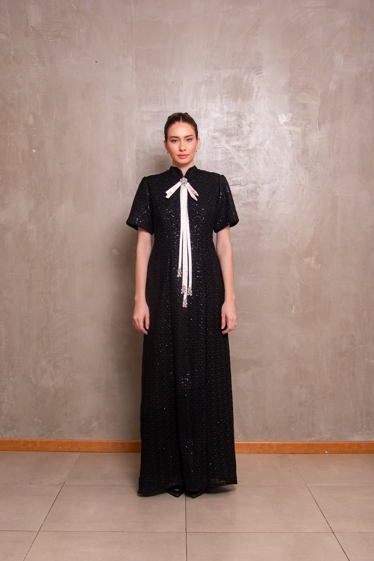 Black Sequin Column Gown with Contrast White Bow Tie