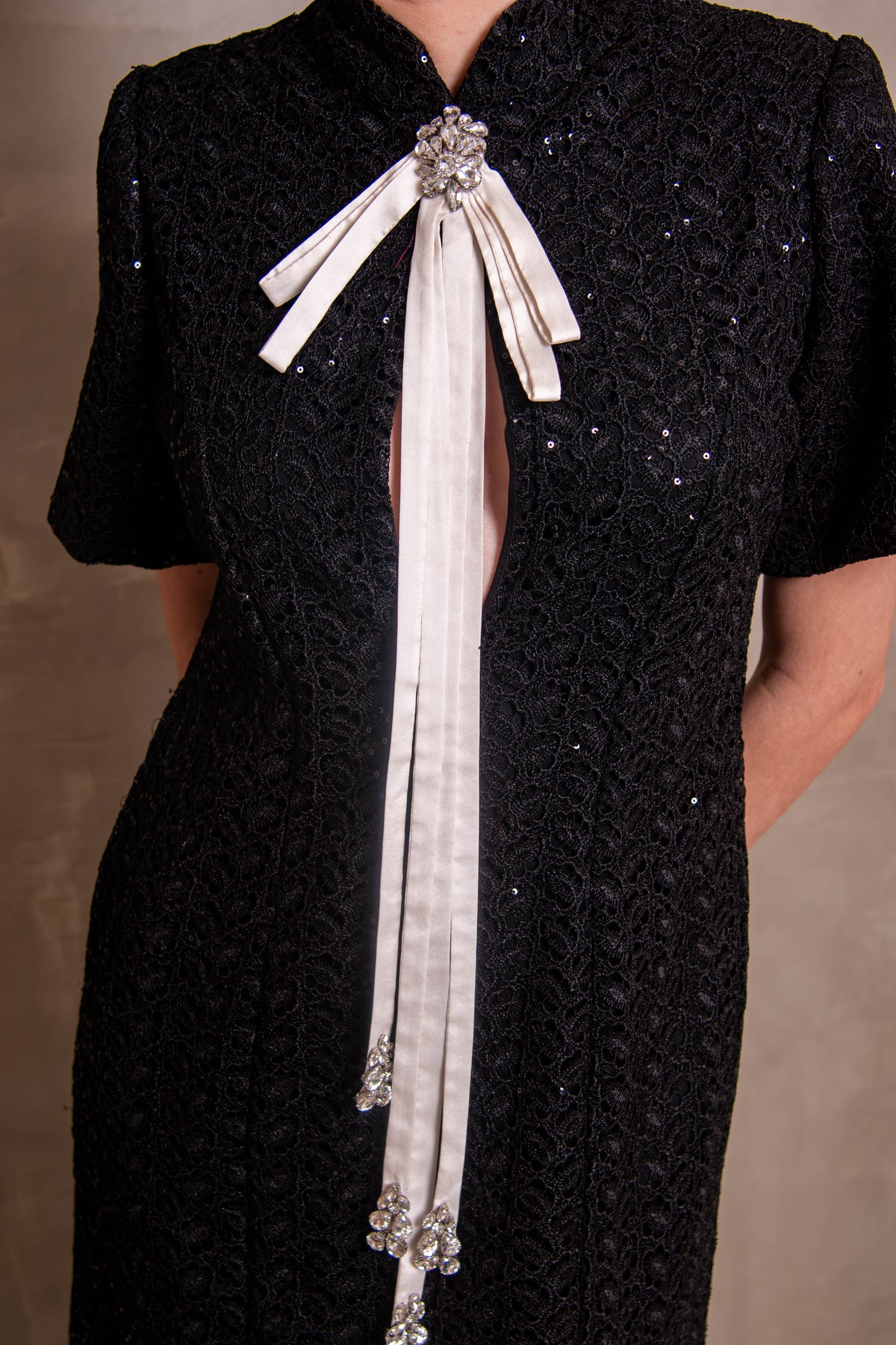 Black Sequin Column Gown with Contrast White Bow Tie
